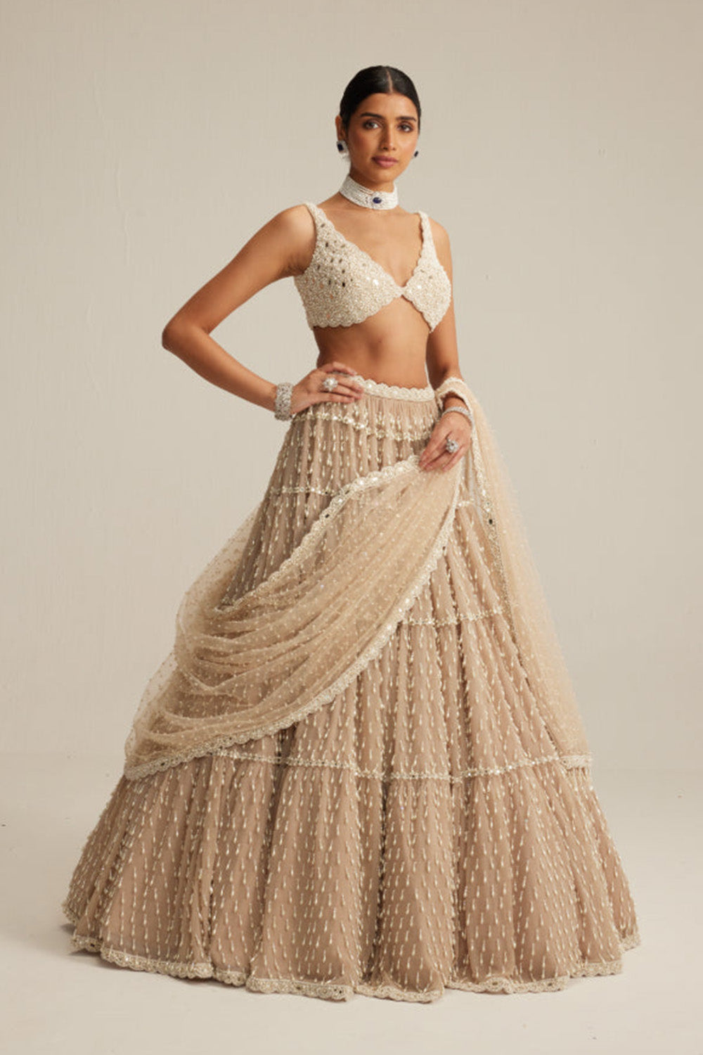 Light Beige Pearl Drop Multi Tier Lehenga Set.