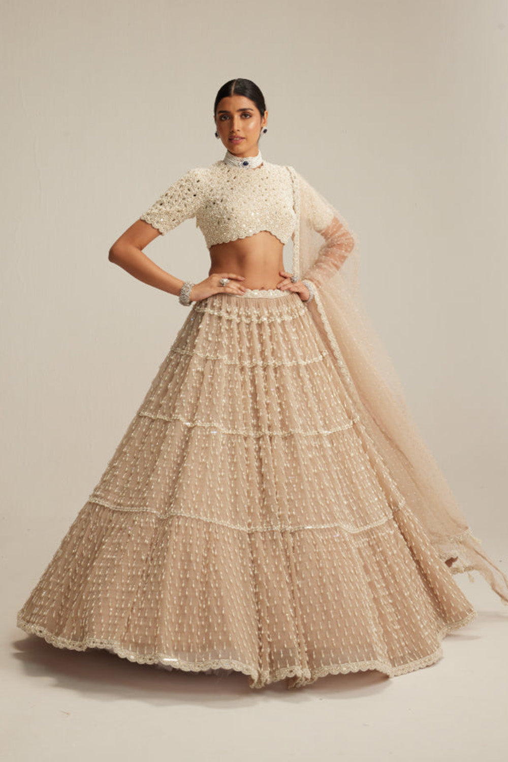Light Beige Pearl Drop Multi Tier Lehenga With High Neck Blouse Set.