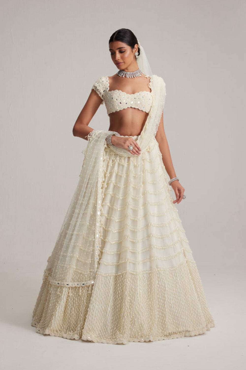 Off White Mirror and Pearl Drop Bridal lehenga set with Veil
