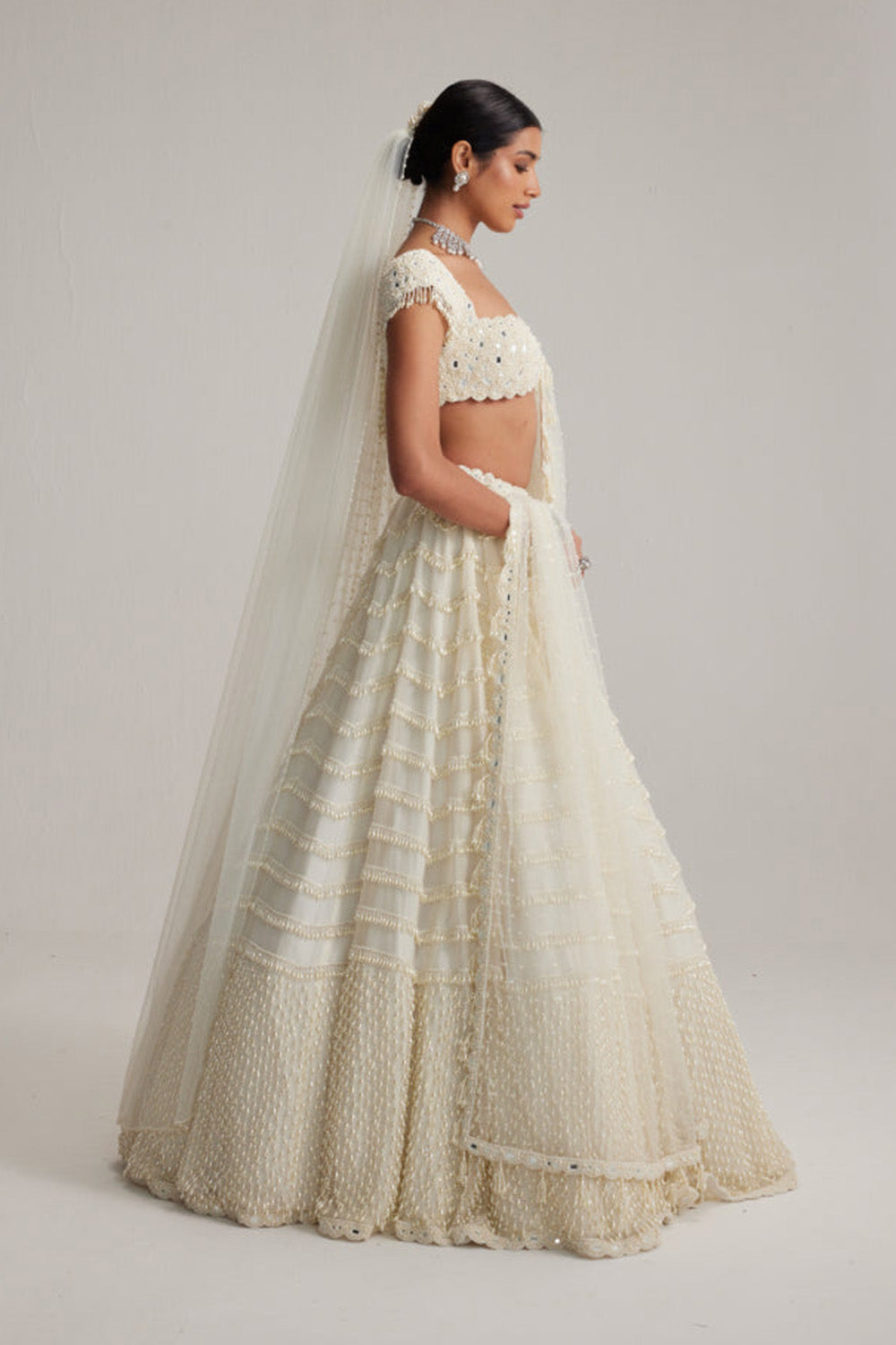 Off White Mirror and Pearl Drop Bridal lehenga set with Veil