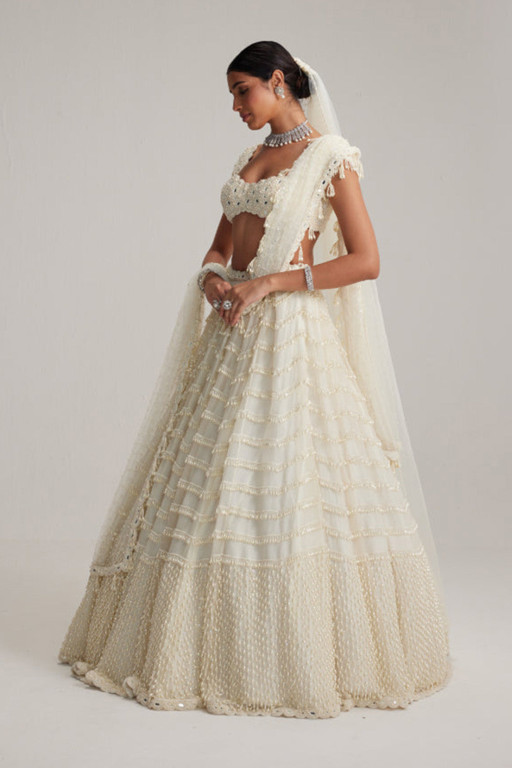 Off White Mirror and Pearl Drop Bridal lehenga set with Veil
