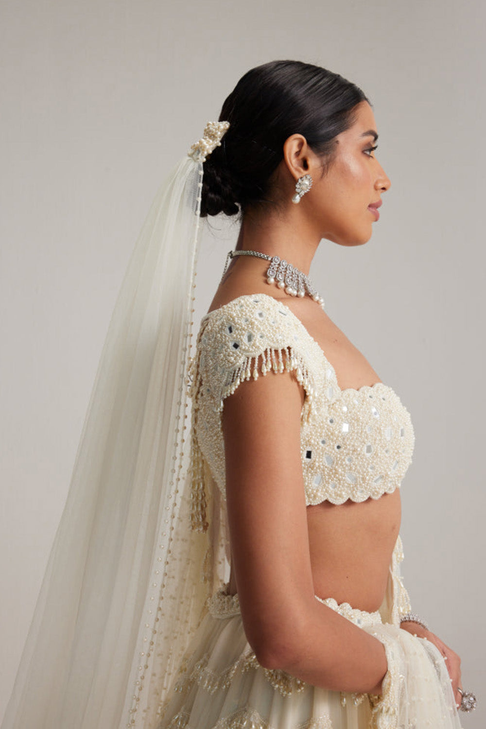 Off White Mirror and Pearl Drop Bridal lehenga set with Veil