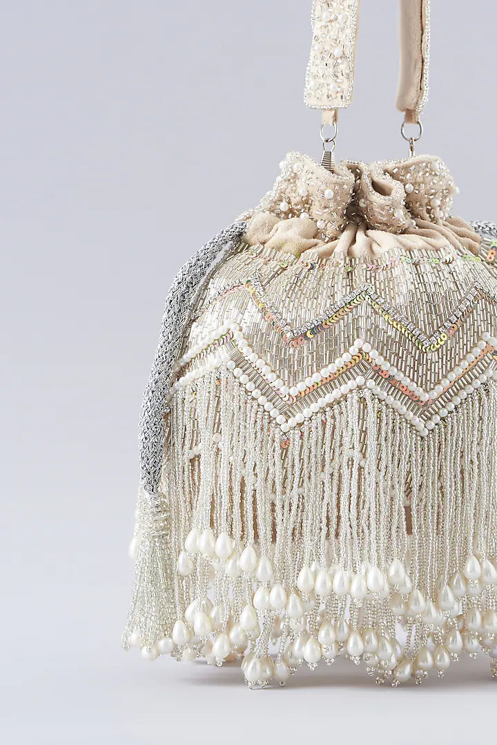 CY A Clutch Story Beige Pearl Tassel Potli Closeup 1