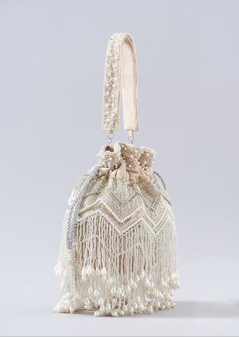 CY A Clutch Story Beige Pearl Tassel Potli Front 4