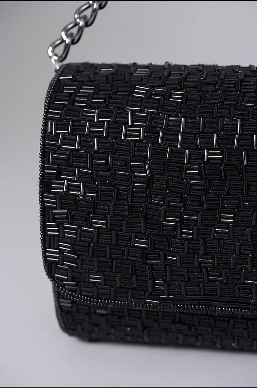 CY A Clutch Story Black Weave Flapover Clutch Closeup 1