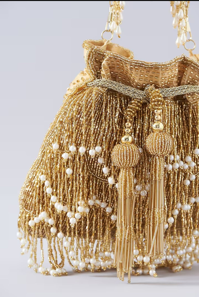 CY A Clutch Story Gold Fringe Glam Potli Closeup 1