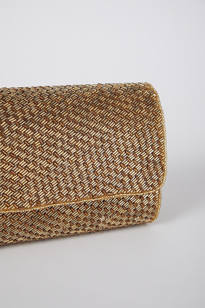 CY A Clutch Story Gold Weave Flapover Clutch Closeup 1
