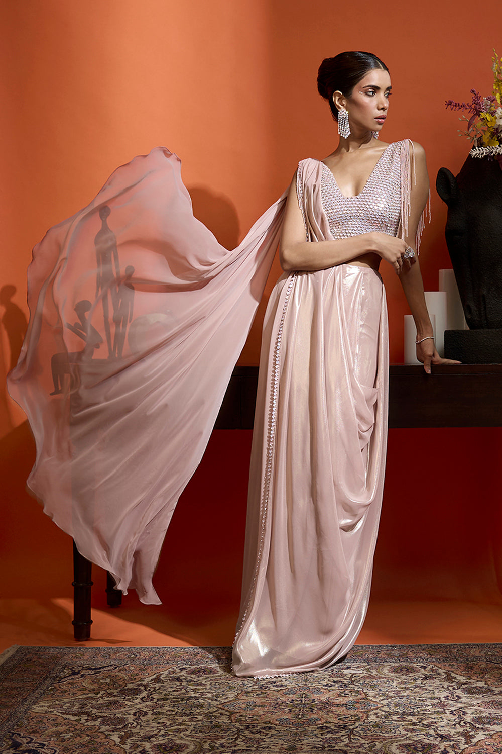 Metallic Blush Drape Saree Coupled with an Embellished Blouse