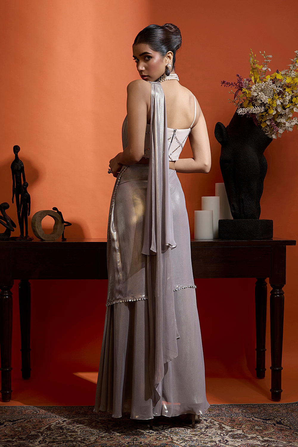 Metallic Silver Drape Saree Coupled with a Beaded Blouse