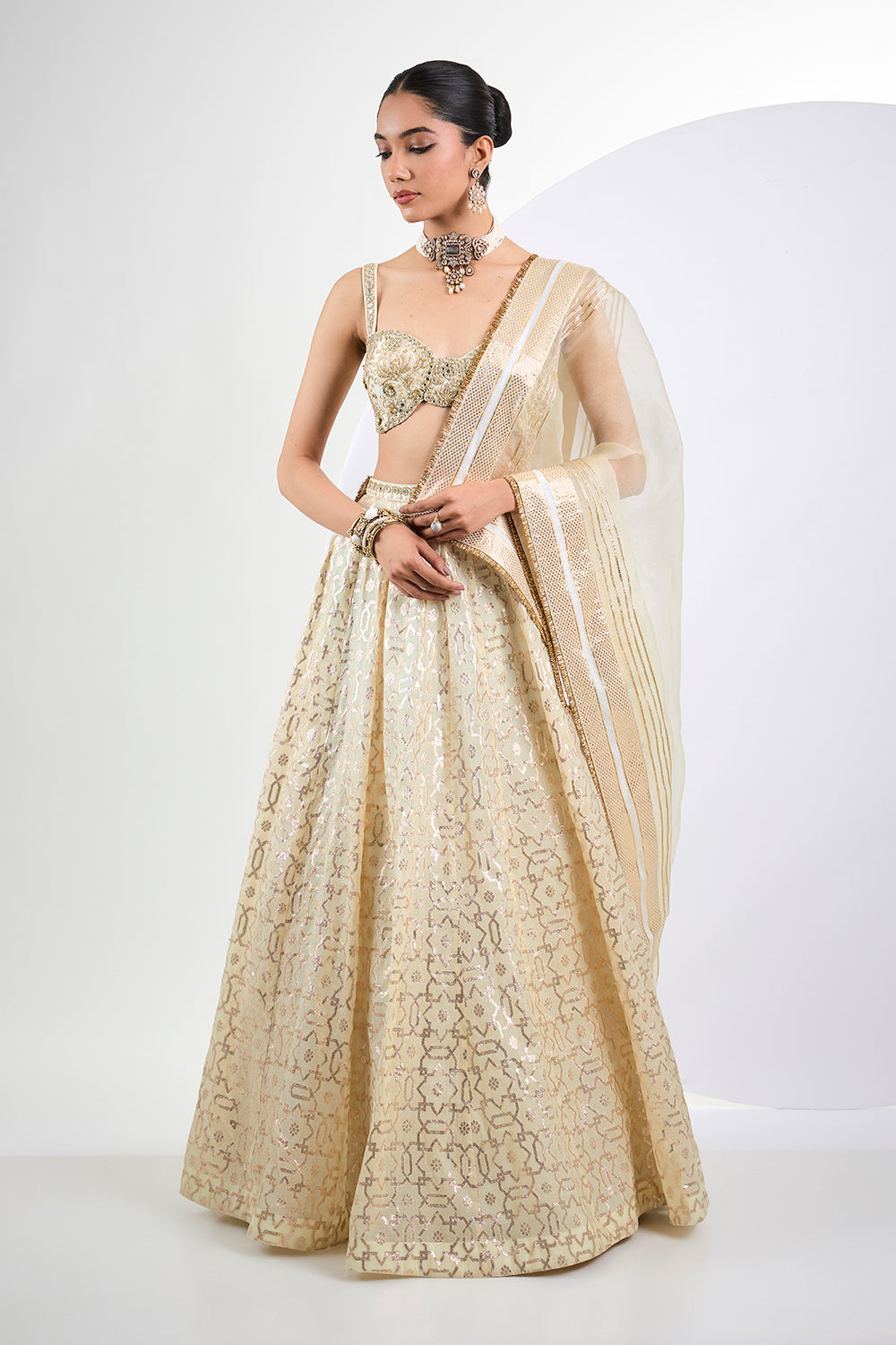 Ivory Banarasi lehenga with hand embroidered blouse and Dupatta