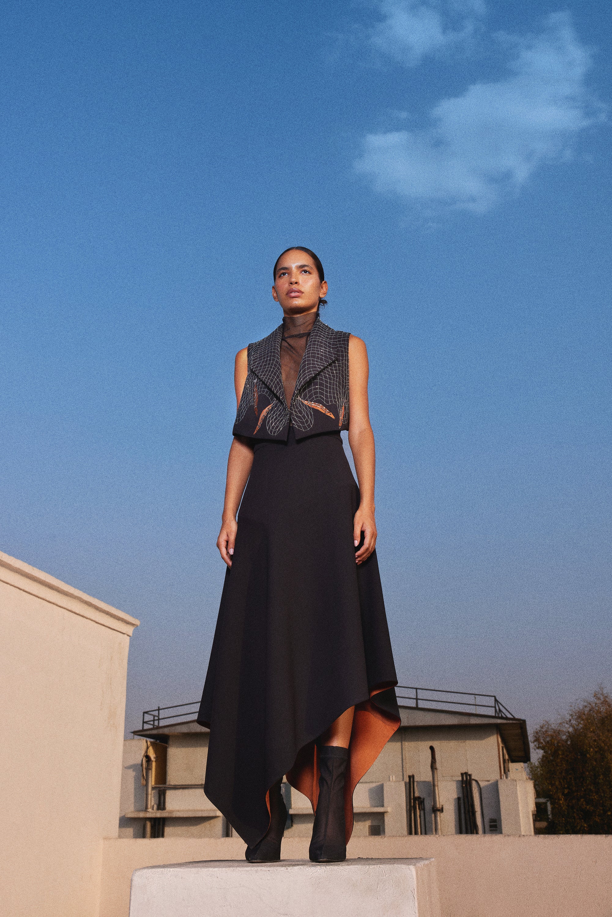 FISH IN THE NET' CROPED SLEEVELESS JACKET WITH ASYMMETRIC SKIRT
