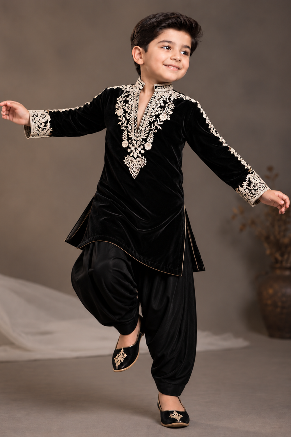 Black Velvet Kurta Set Featuring Inticate Golden Embroidery Paired With Classic Salwar