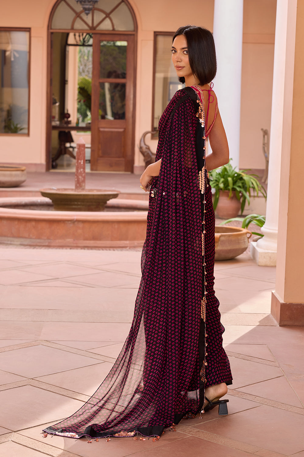 Black bandhani printed pre stitched saree with embroidered pink blouse