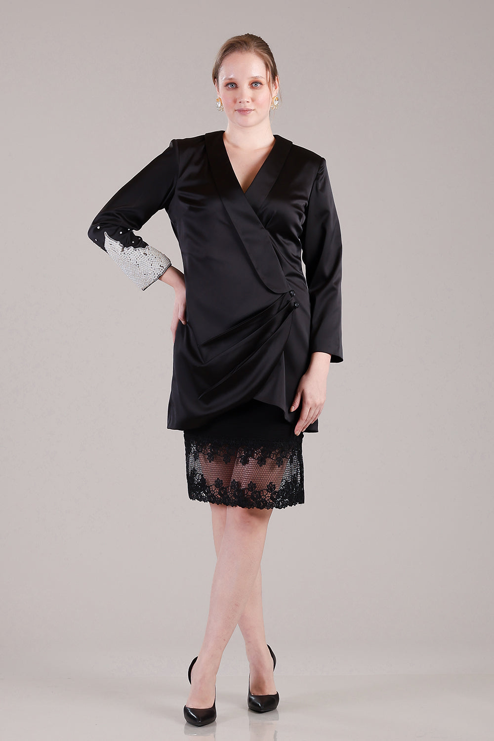 Black coat pleated dress with pearls and crystals detailing on one sleeve