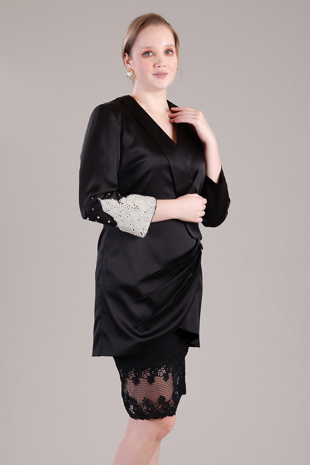 Black coat pleated dress with pearls and crystals detailing on one sleeve
