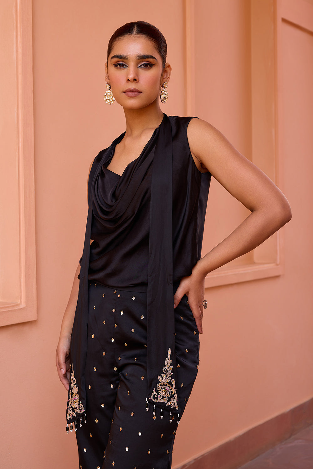 Black cowl drape top with embroidered pants