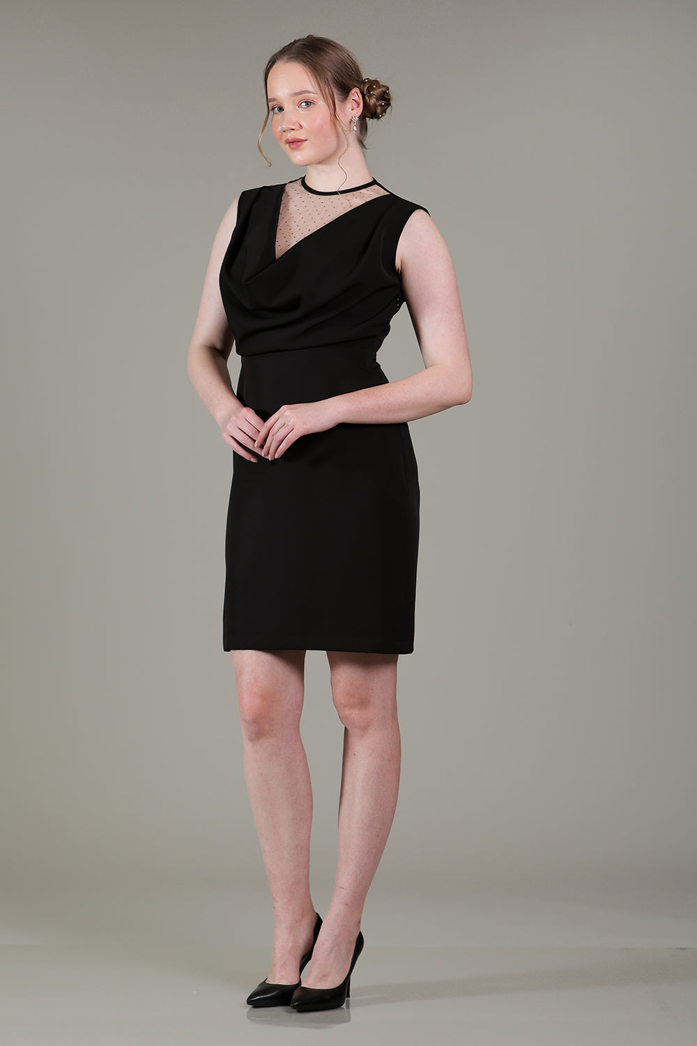 Black cowl dress with sheer net and rose gold rhinestone detailing on bodice