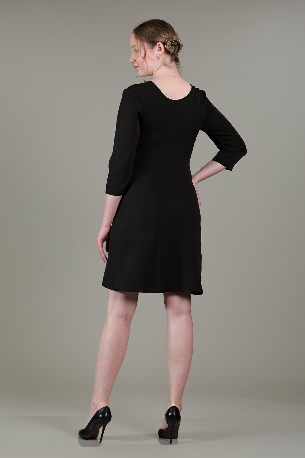 Black dress with gold chain detailing on neck