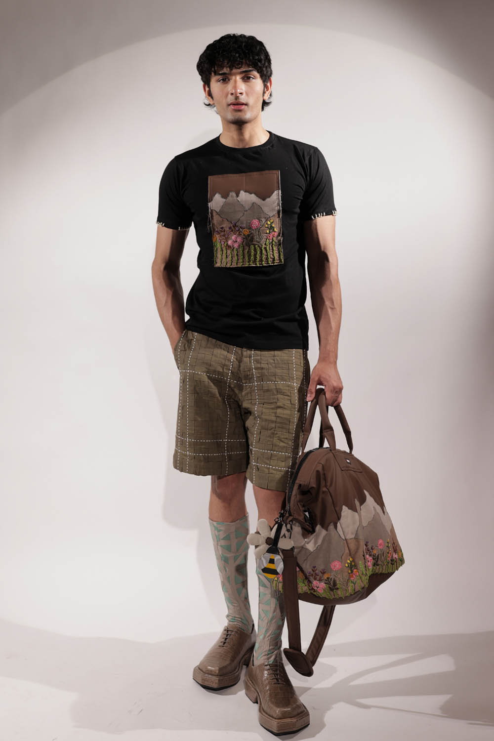 Black T-shirt with Valley-inspired patchwork