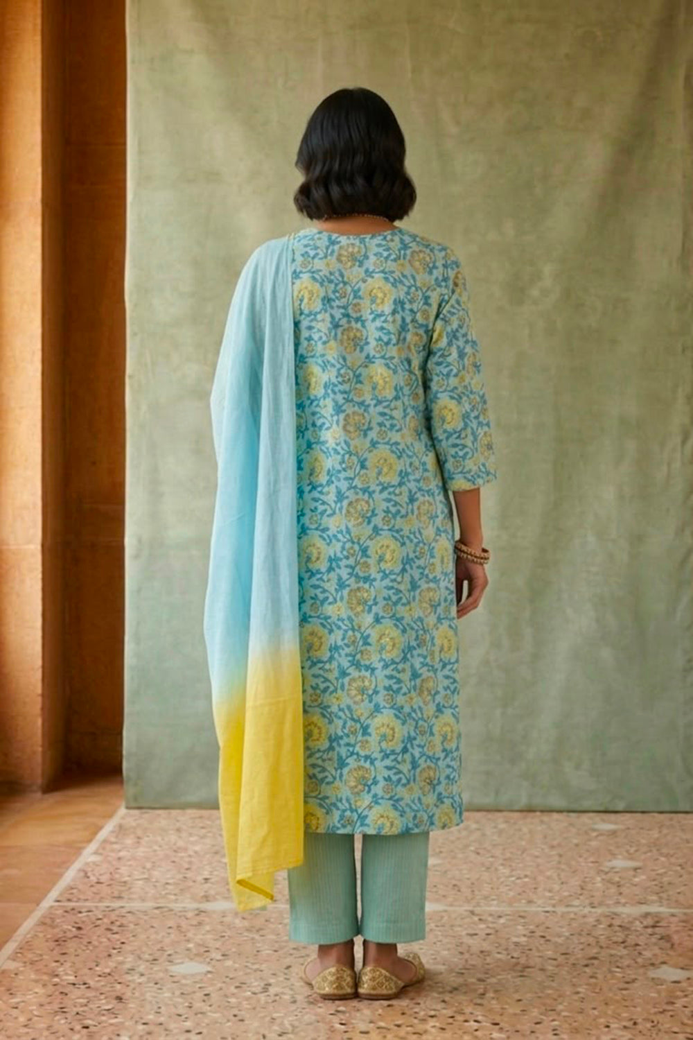 Blue allover block printed kurta paired with strips pants along with shaded duppata