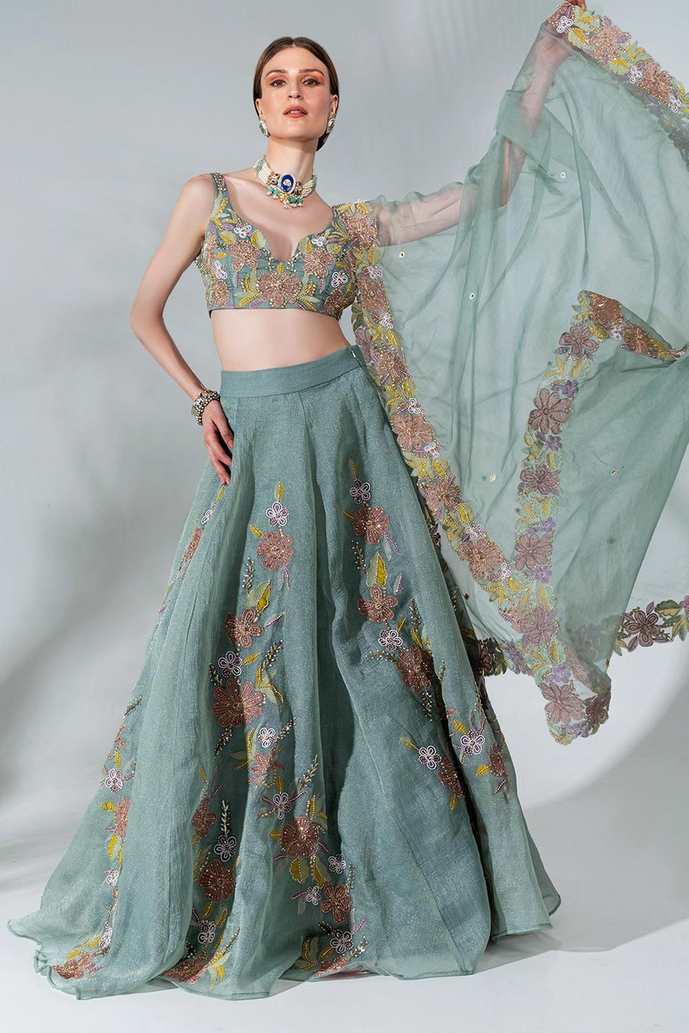 Dusty green lehenga featuring floral applique patterns