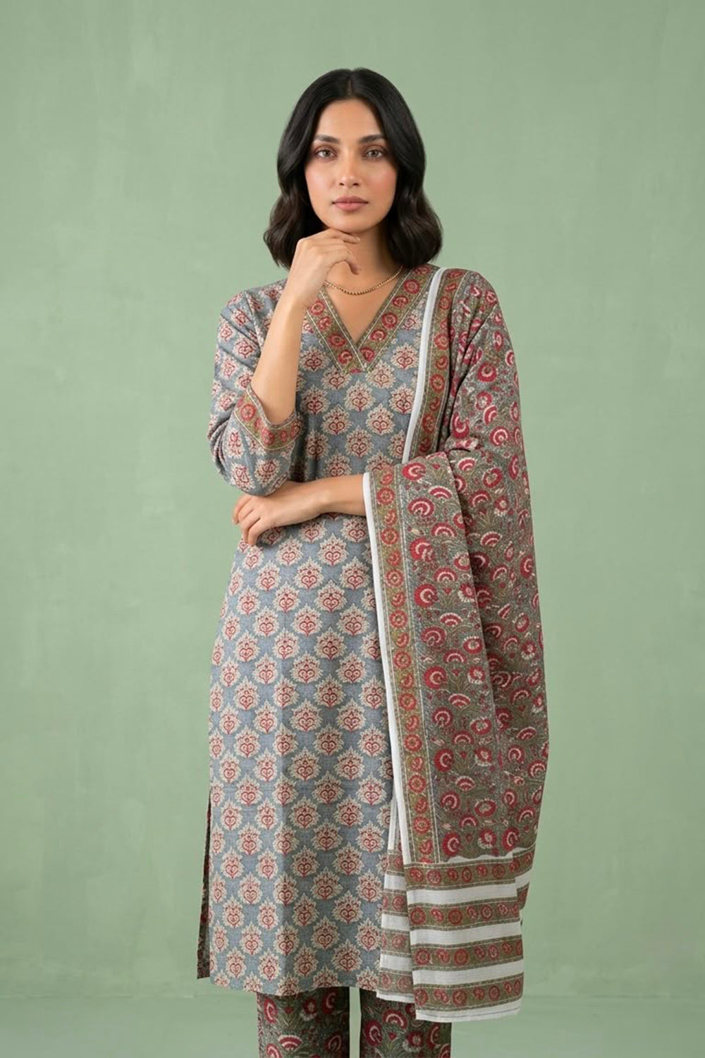 Grey suit paied with allover printed pants and dupatta