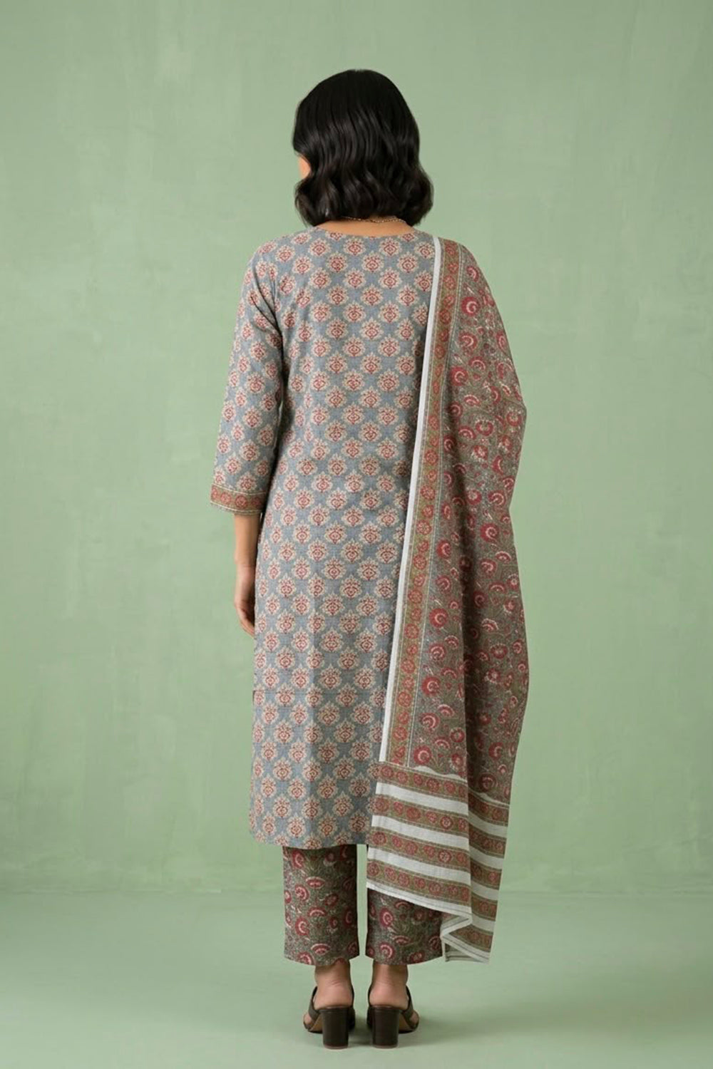 Grey suit paied with allover printed pants and dupatta