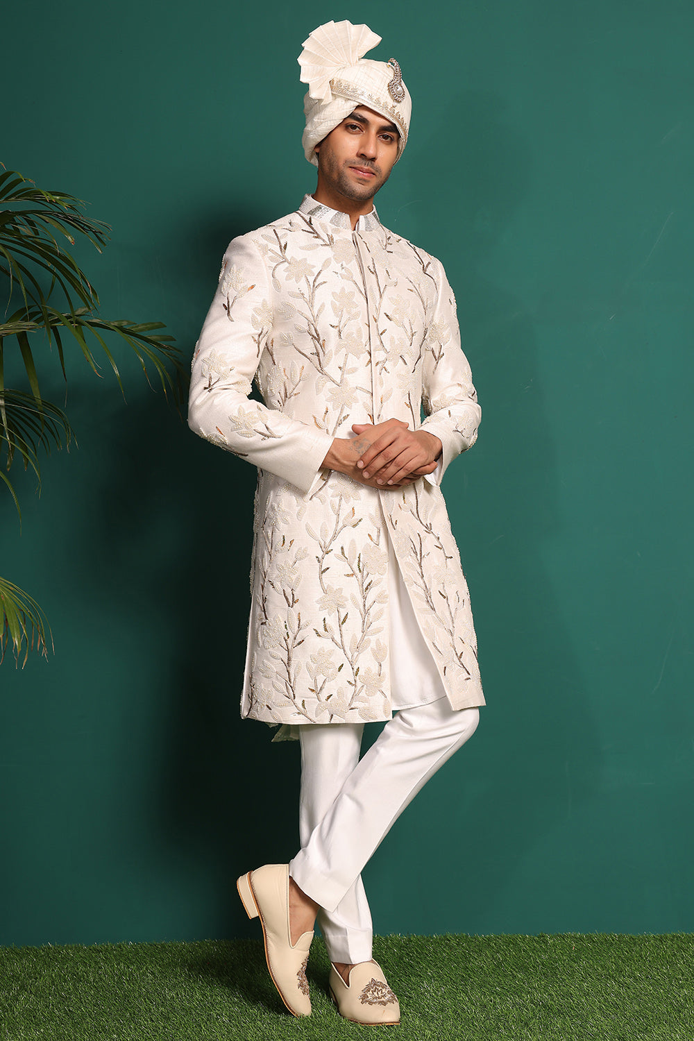 Ivory white raw silk sherwani with heavy embellished work