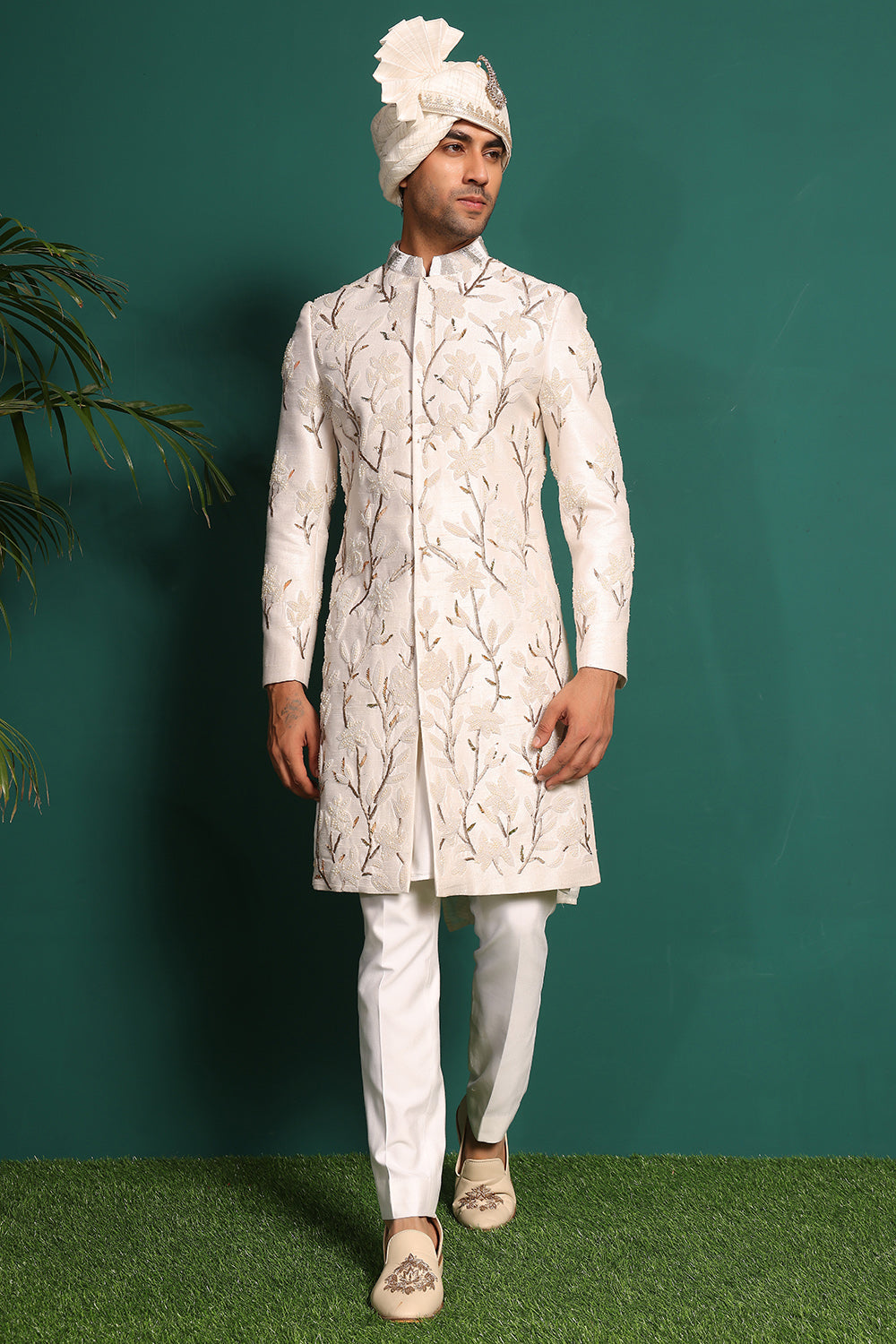 Ivory white raw silk sherwani with heavy embellished work