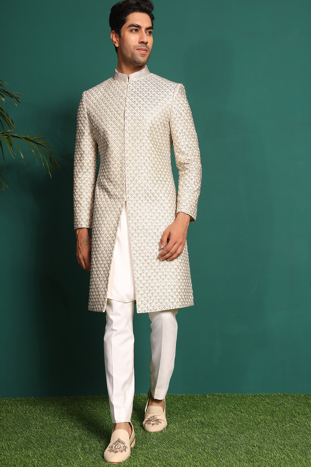 Ivory White Sherwani heavily embellished with moti and cutdaana