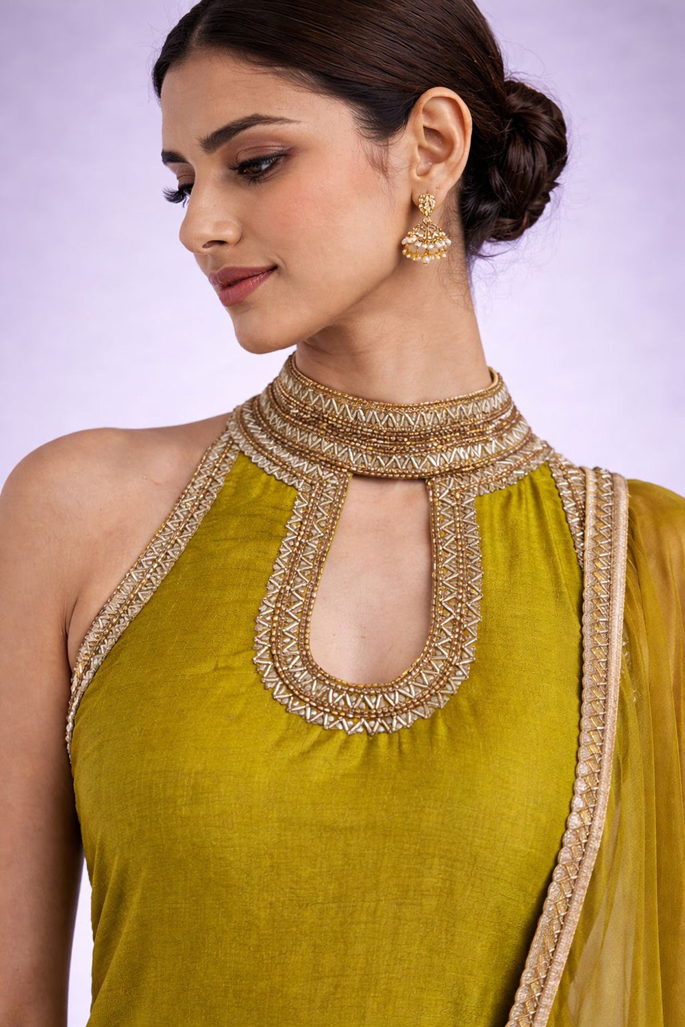 Lime Green Kurta Set with delicate embroidery on neck,and sides.
