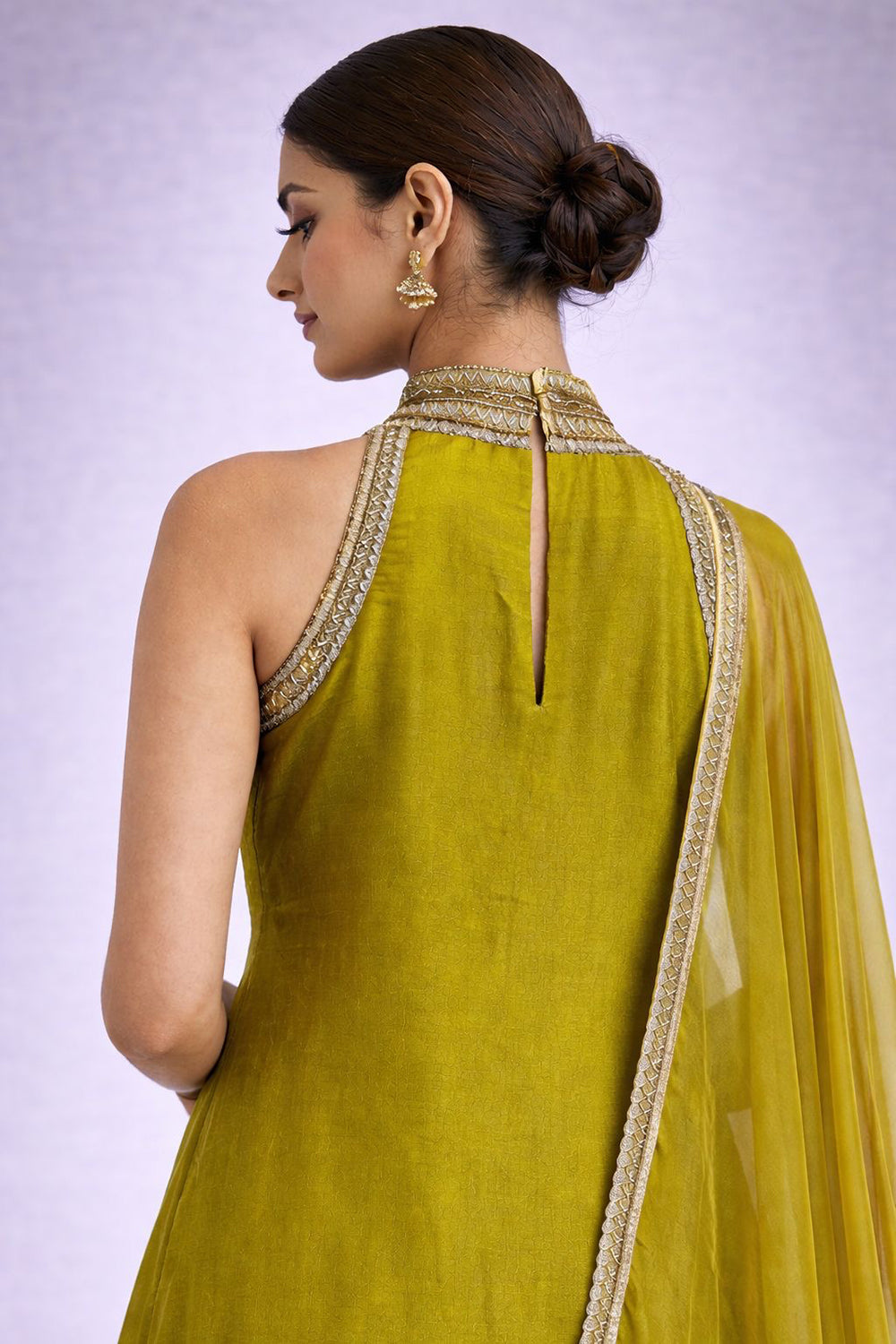 Lime Green Kurta Set with delicate embroidery on neck,and sides.
