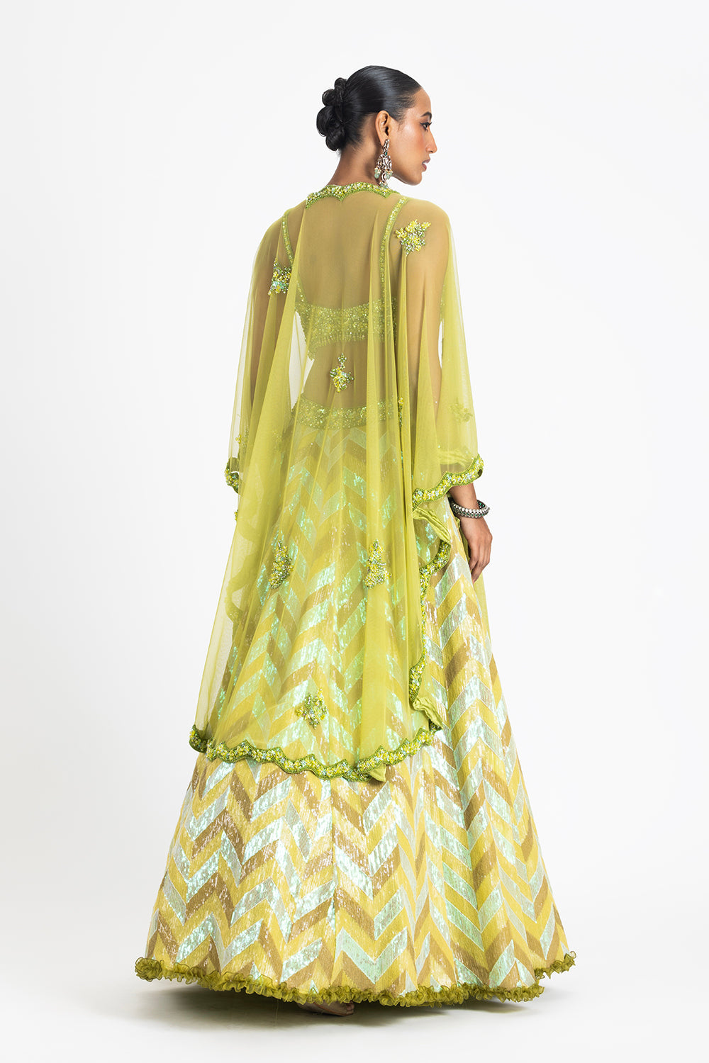 Mehndi Green Sequinned Lehenga With A Bustier And Net Cape
