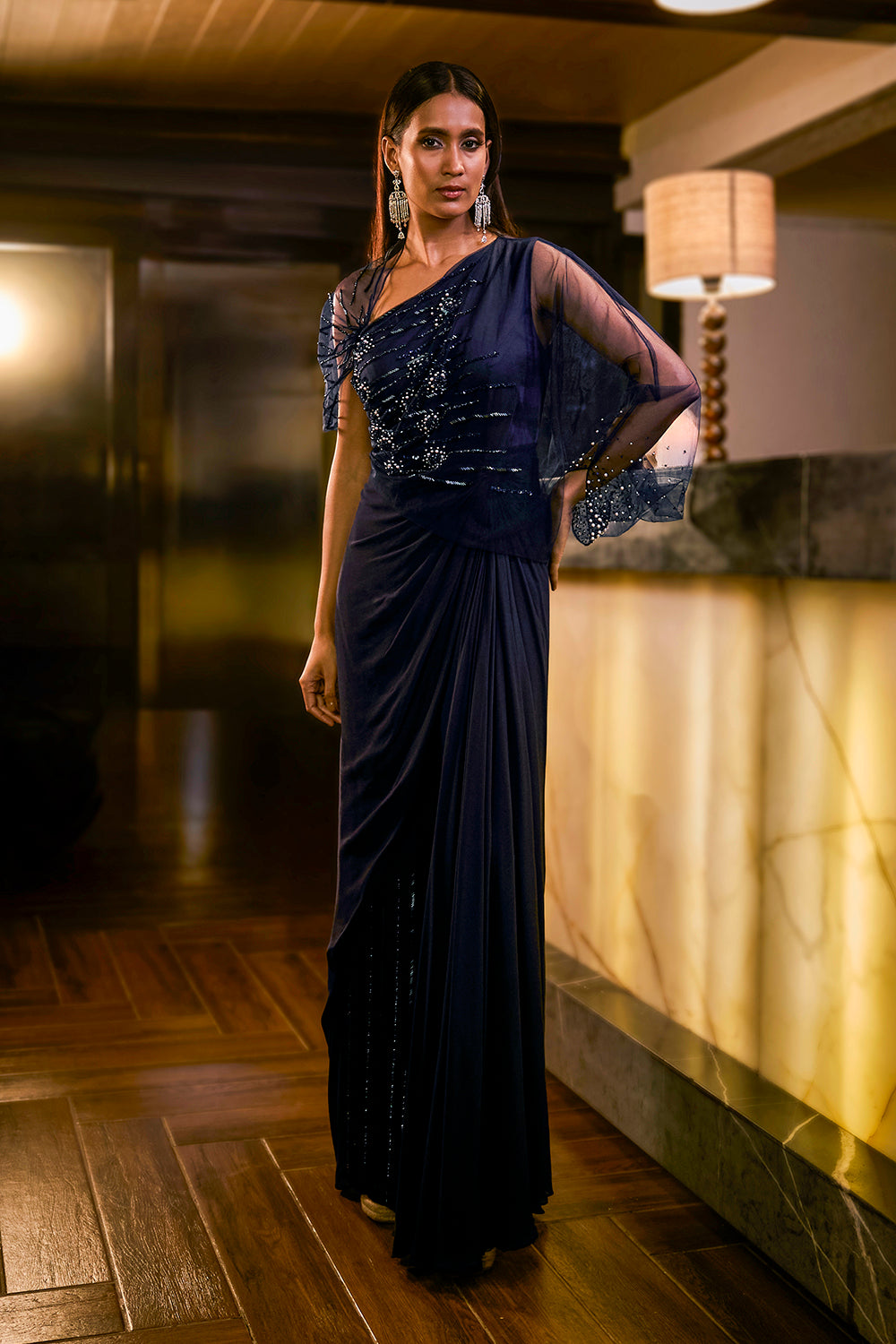 Midnight Blue jumpsuit with sheer sleeve and draped silhouette