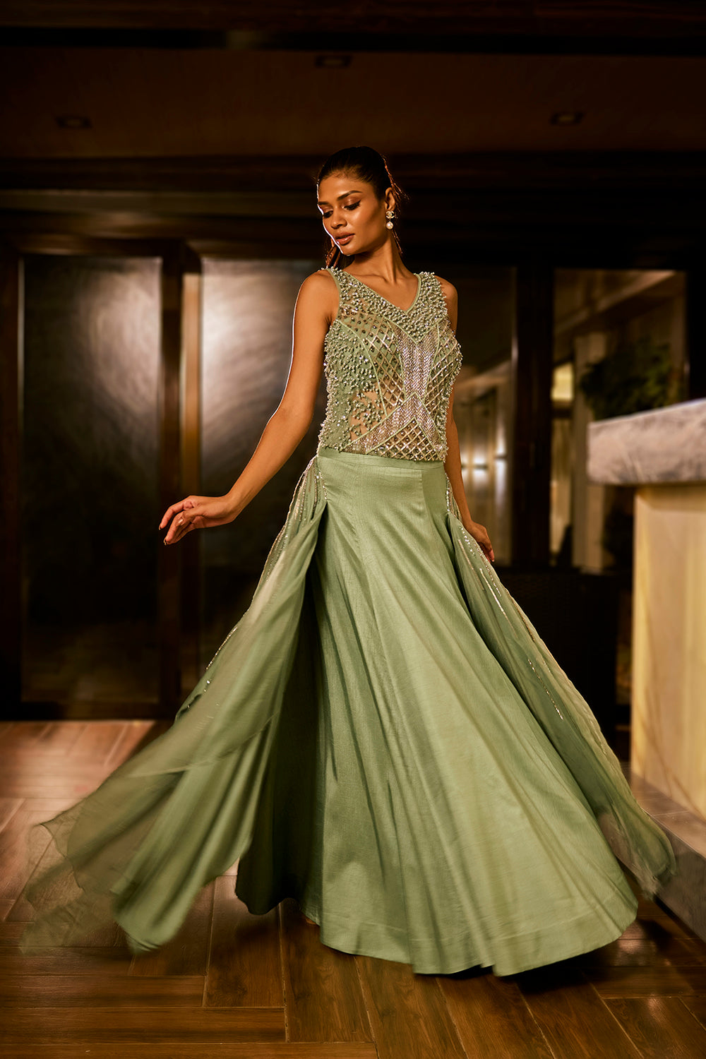 Mint green lehenga set with an embellished blouse