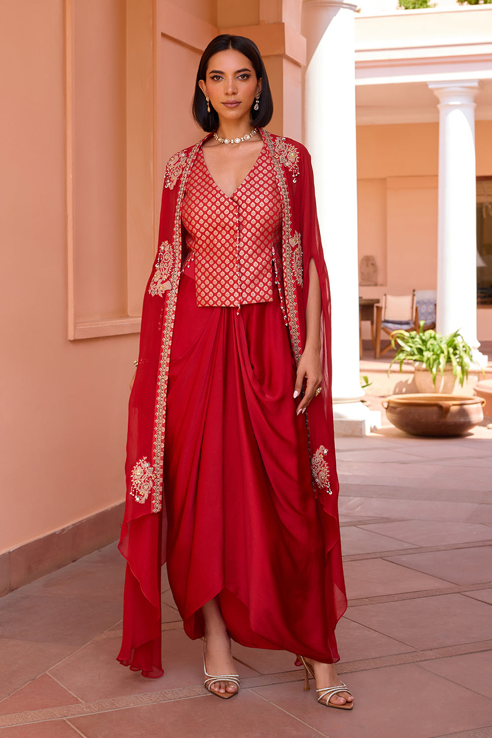 Red embroidered cape with waistcoat and skirt