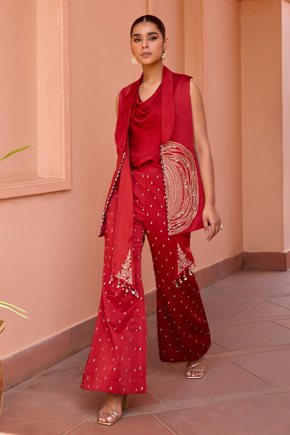 Red embroidered jacket with drape top and pants