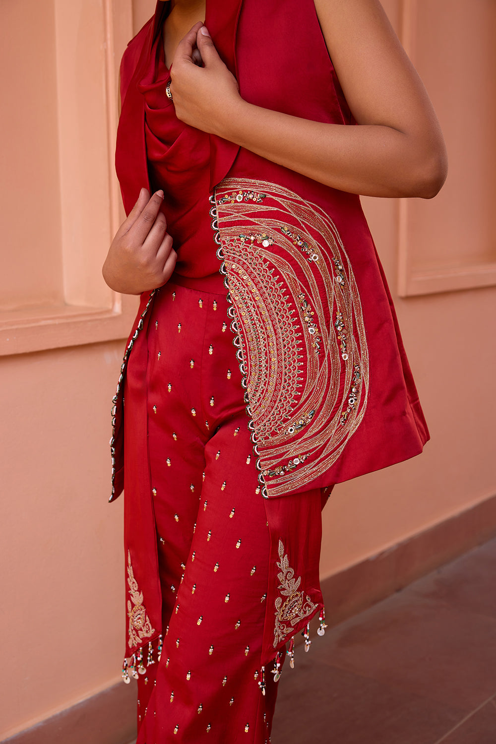 Red embroidered jacket with drape top and pants