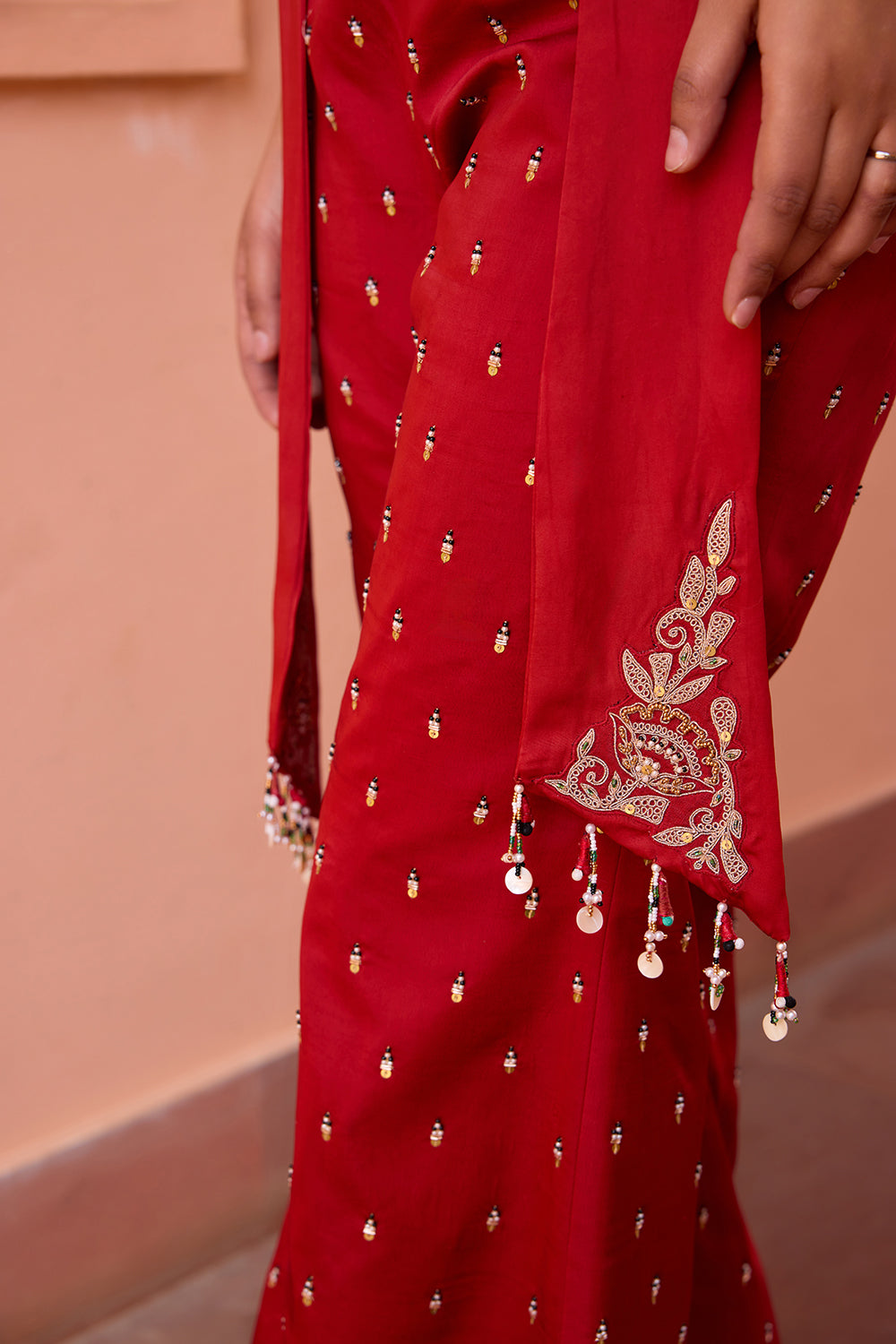 Red embroidered jacket with drape top and pants