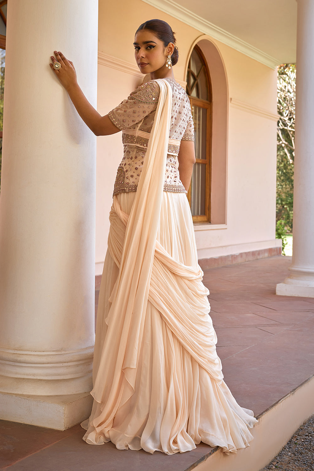 White pre draped lehenga saree with embroidered jacket