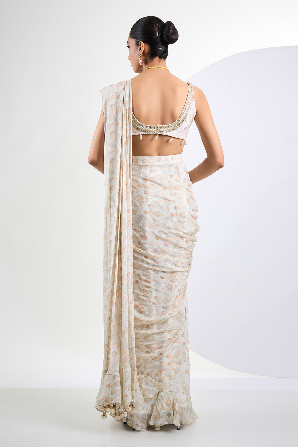 Printed chinon chiffon ivory pre draped saree with pearl tassels