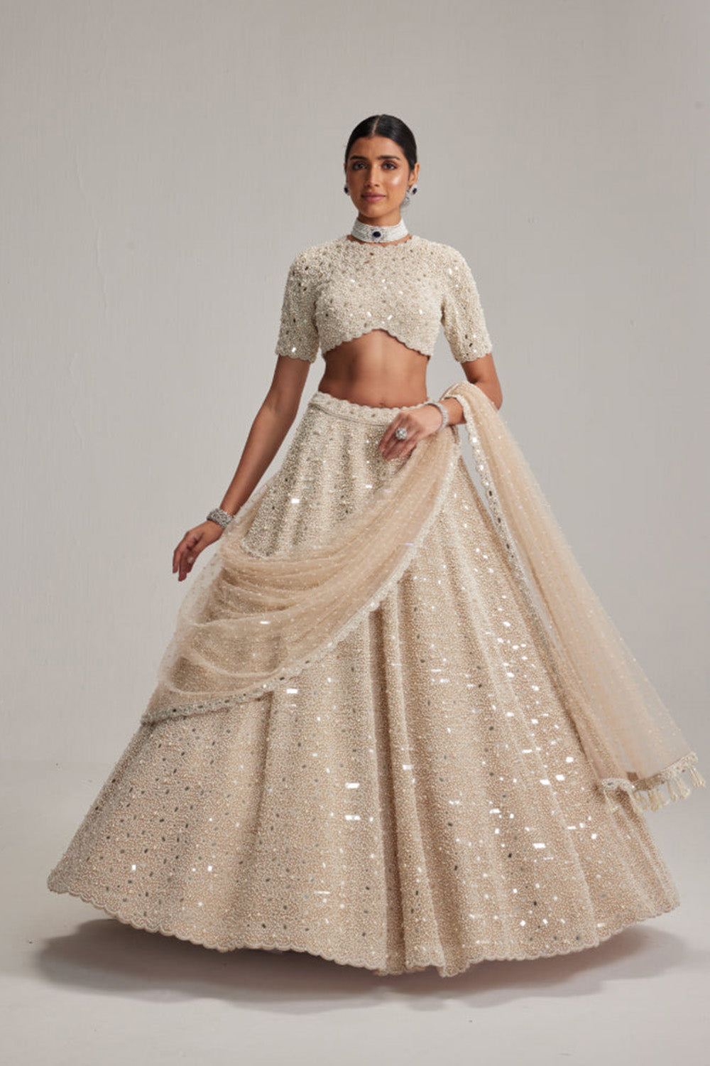 Light Beige Dense mirror and pearl lehenga set with High neck Blouse and Dupatta