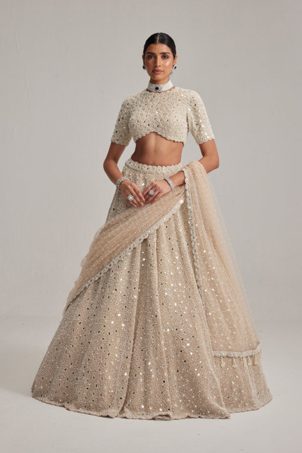 Light Beige Dense mirror and pearl lehenga set with High neck Blouse and Dupatta
