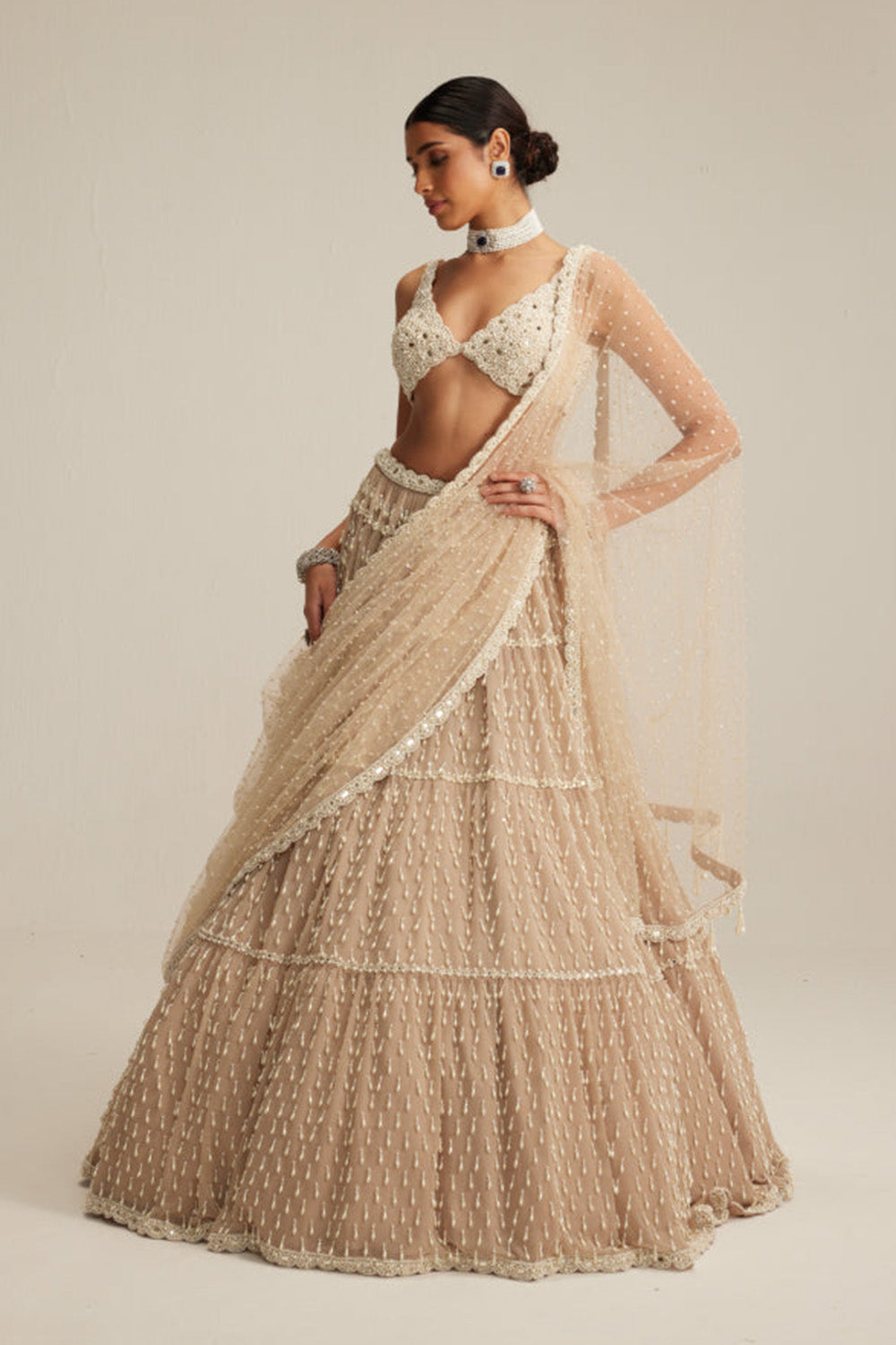 Light Beige Pearl Drop Multi Tier Lehenga Set.