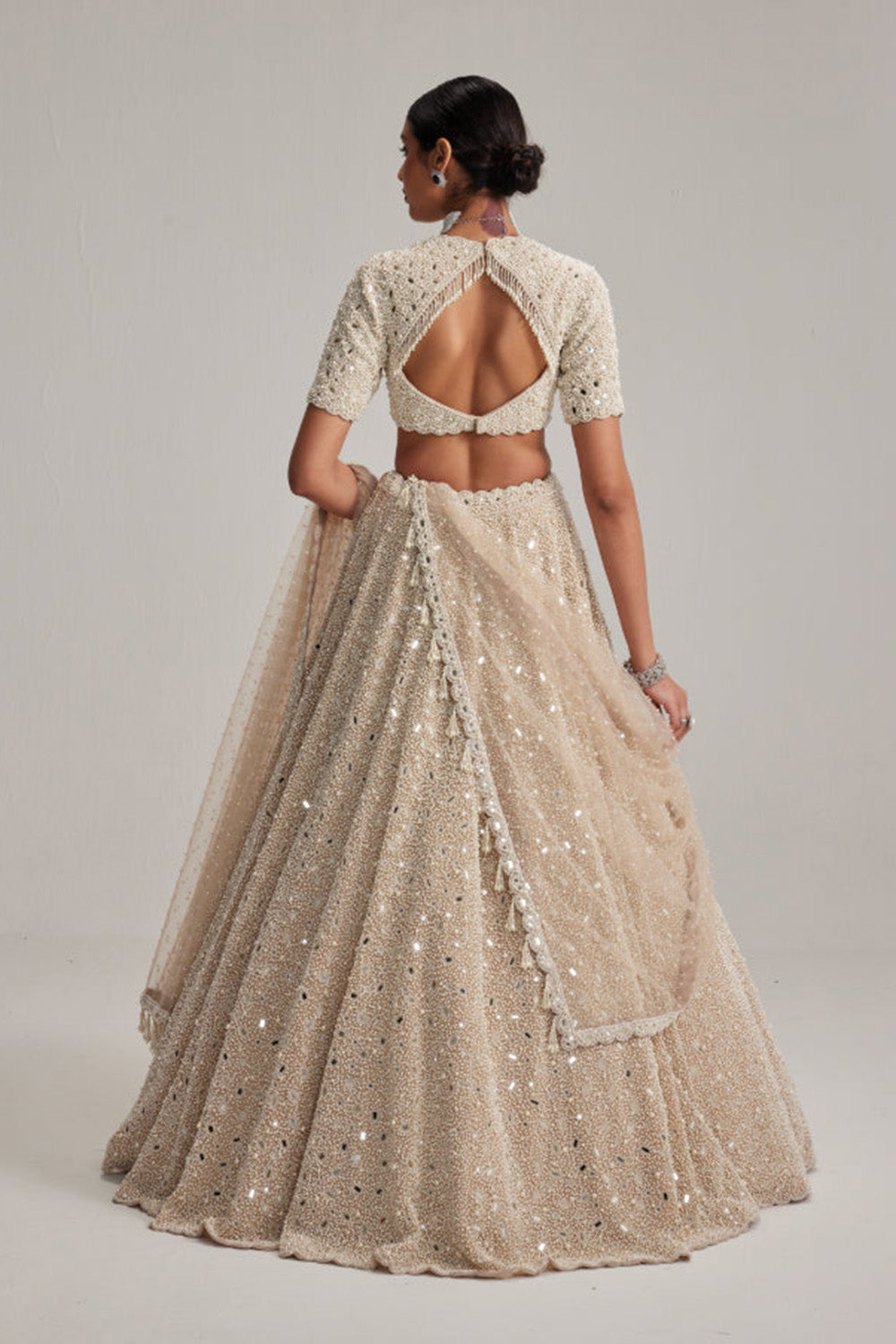 Light Beige Dense mirror and pearl lehenga set with High neck Blouse and Dupatta