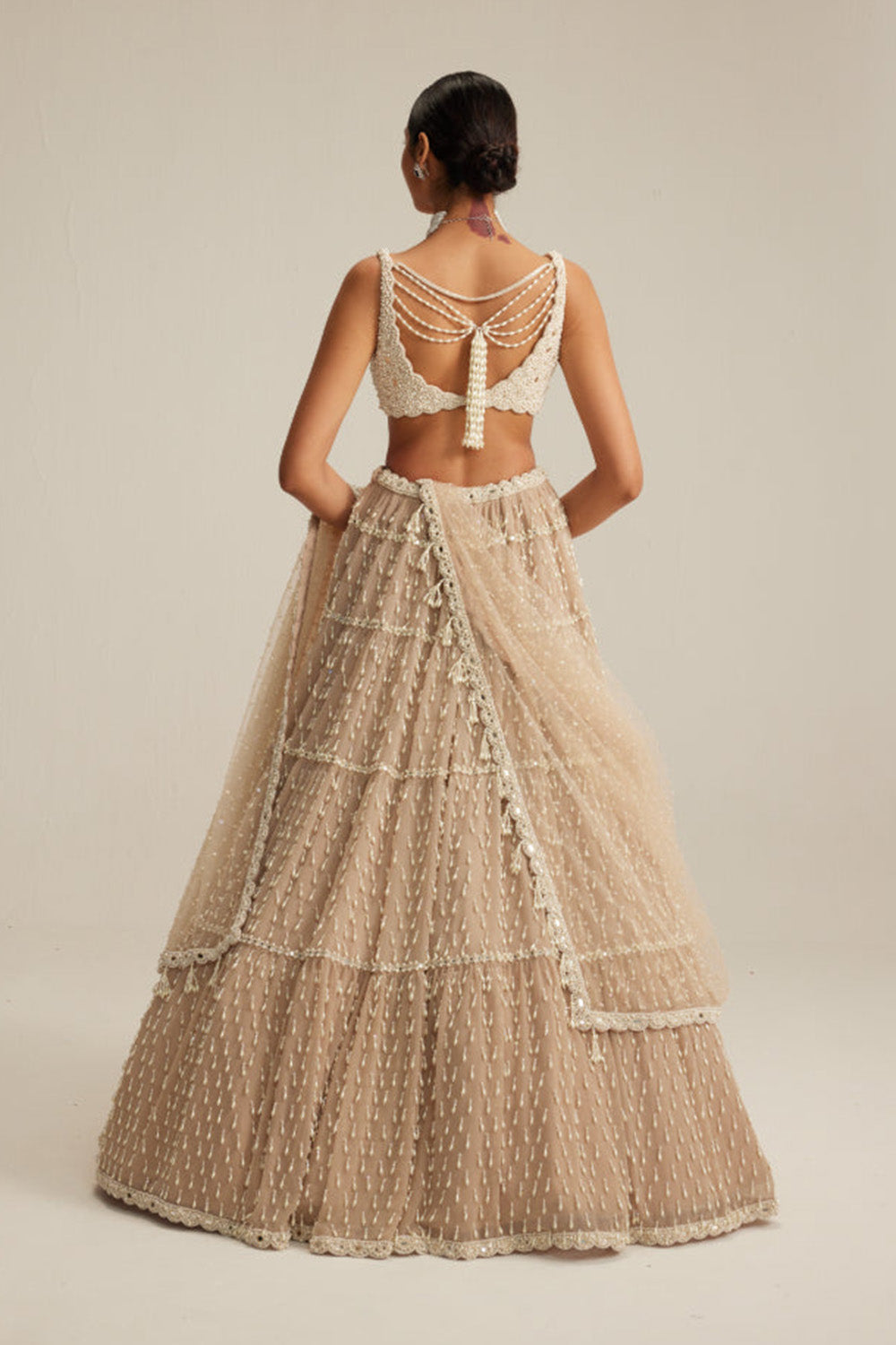 Light Beige Pearl Drop Multi Tier Lehenga Set.