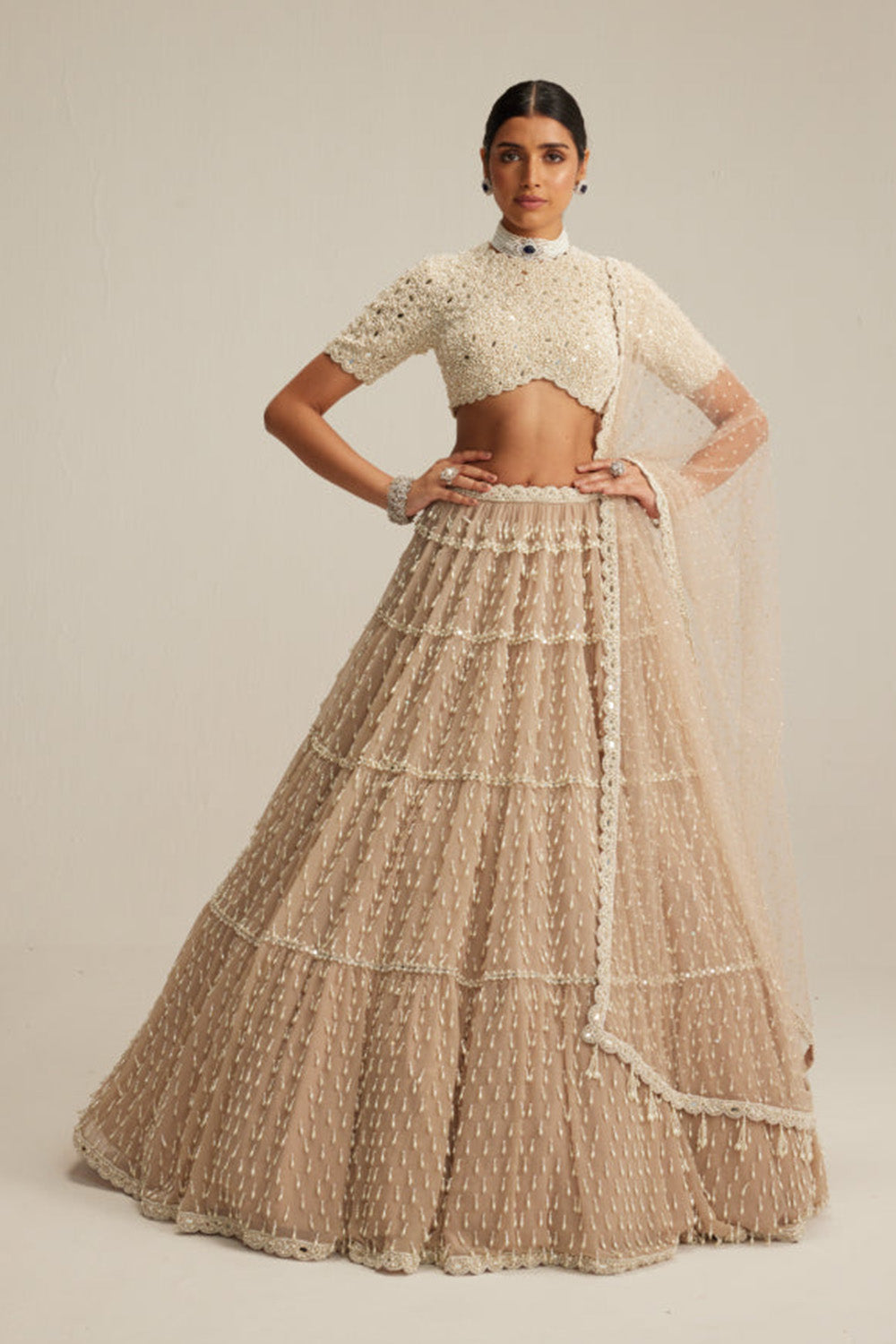 Light Beige Pearl Drop Multi Tier Lehenga With High Neck Blouse Set.