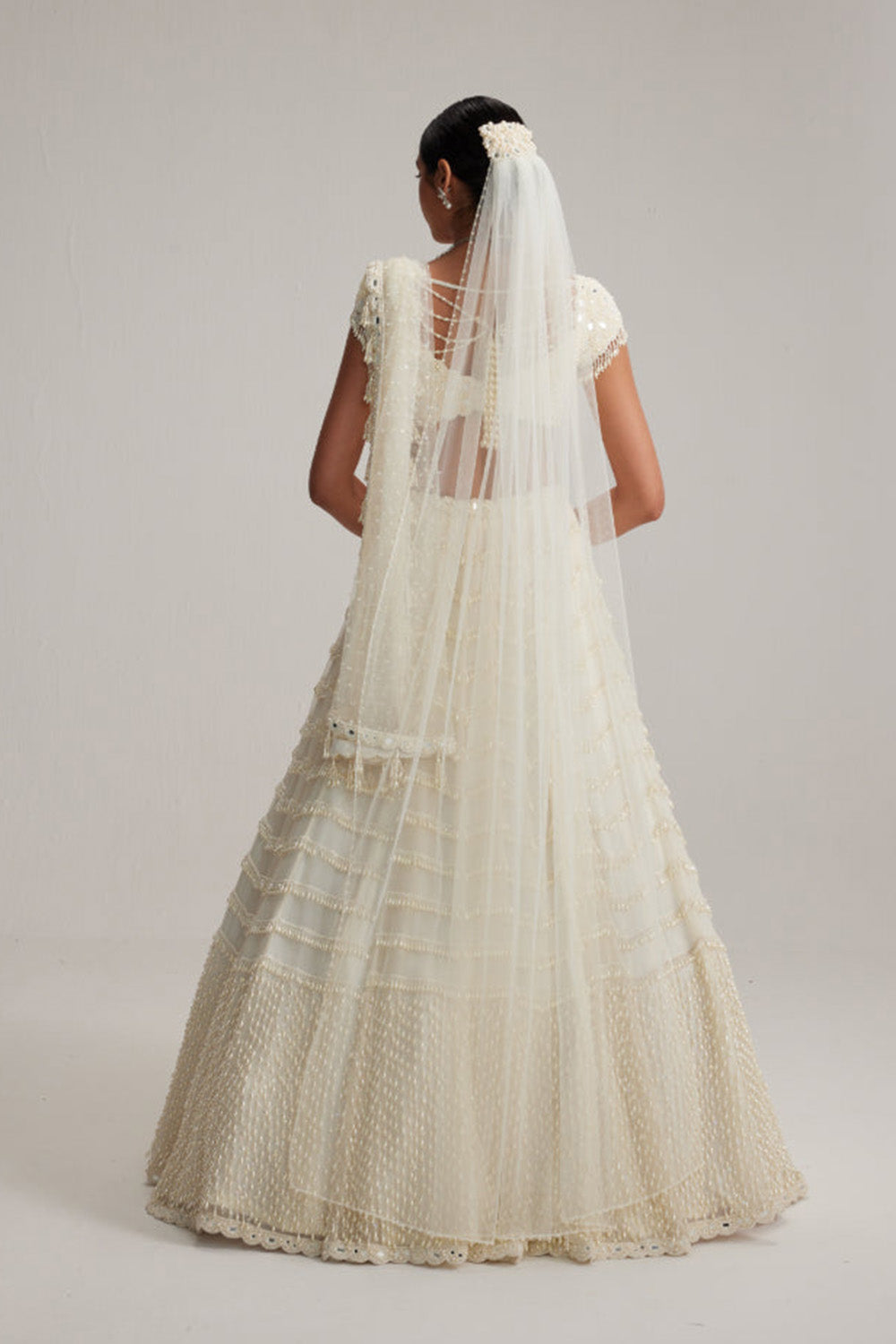 Off White Mirror and Pearl Drop Bridal lehenga set with Veil