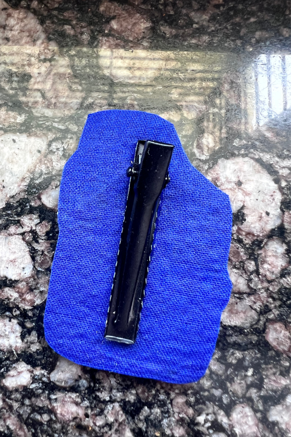 CADBURY CLIP AND BROOCH