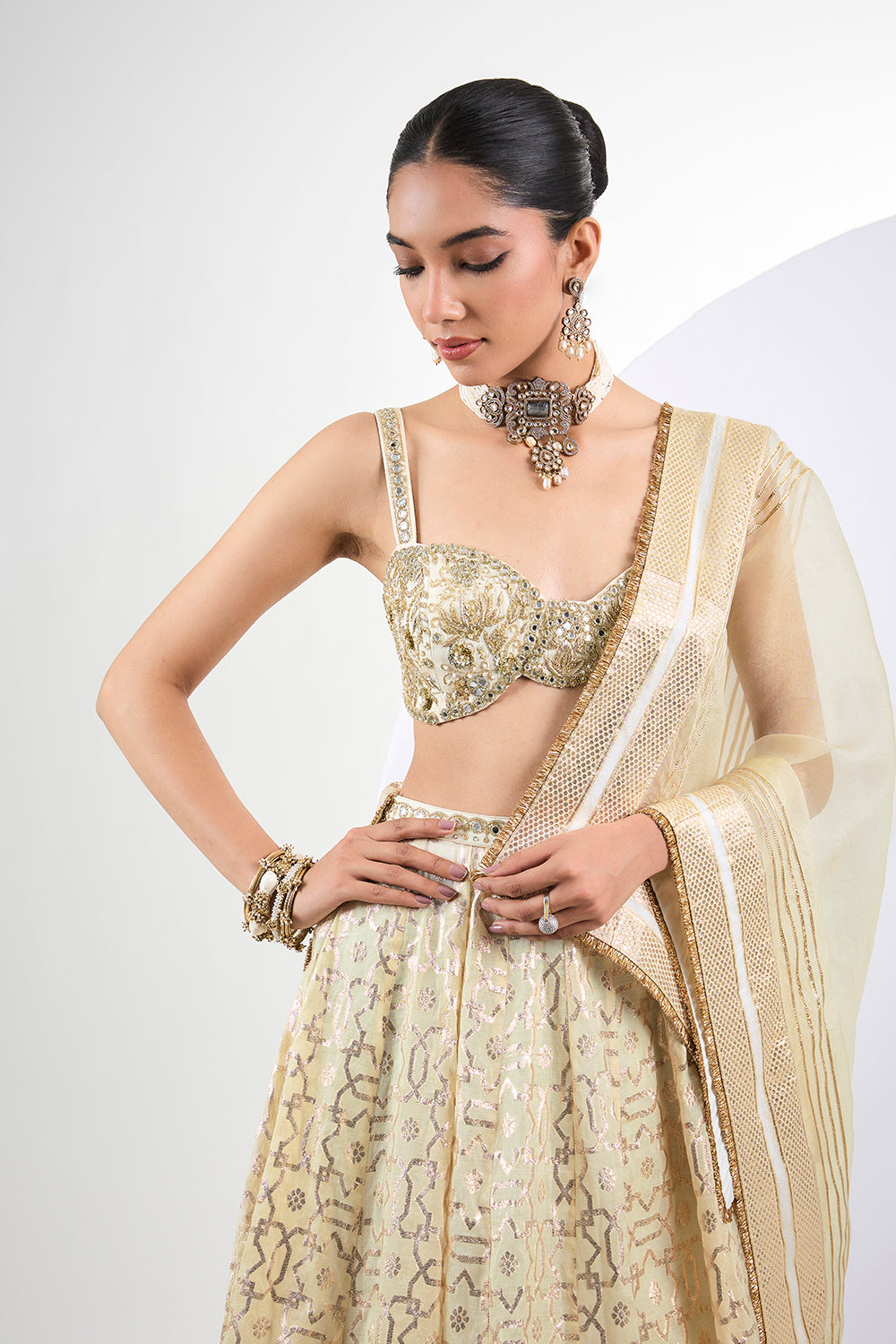 Ivory Banarasi lehenga with hand embroidered blouse and Dupatta